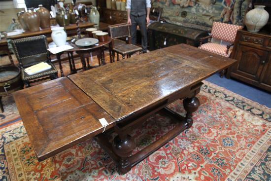A mid 17th century Dutch oak draw leaf table extended 7ft 1.5in.
